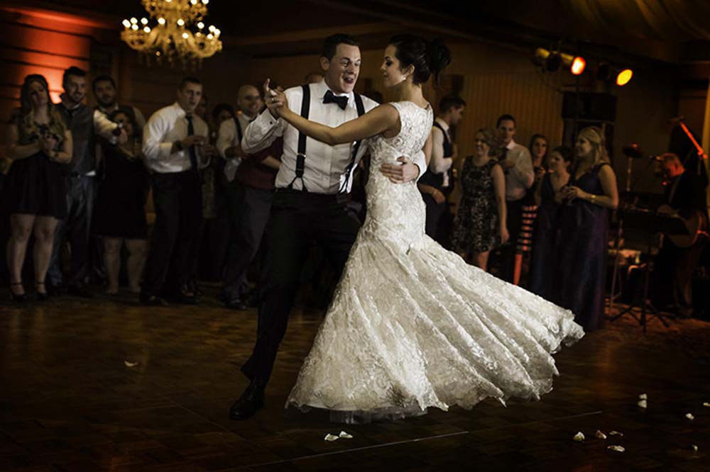 Wedding couple performing a swing dance routine to the music of the Long Island Jazz Orchestra.